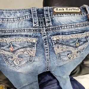 Rock Revival Distressed Blue Jeans with Embellished Pockets Size 24